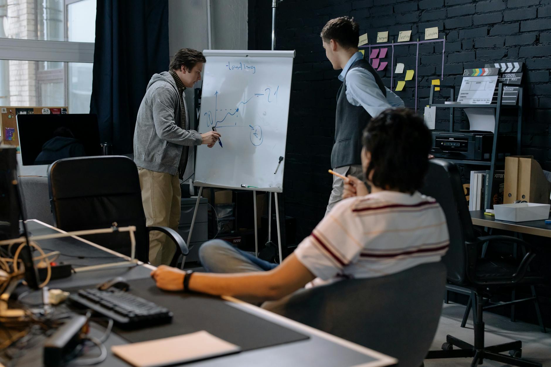 A team of developers collaborating on the Balance app in a modern office.