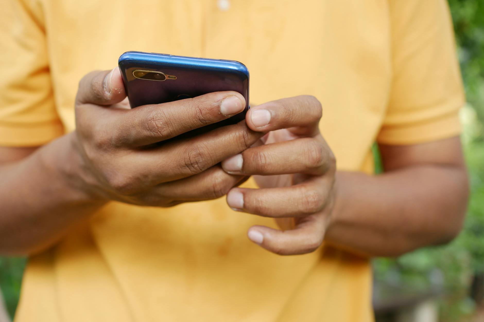 A couple using Balance app on a smartphone to review their finances.